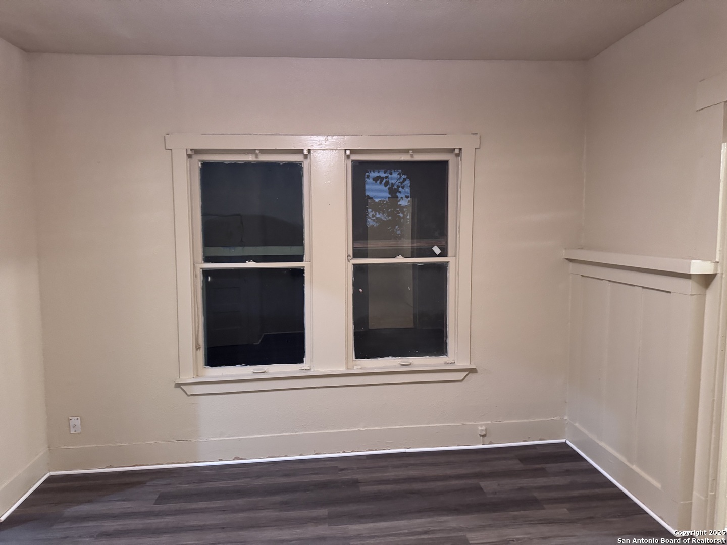 211 Blanco Road San Antonio, TX 78212 - Photo 22 of 34 a view of an empty room with wooden floor and a window