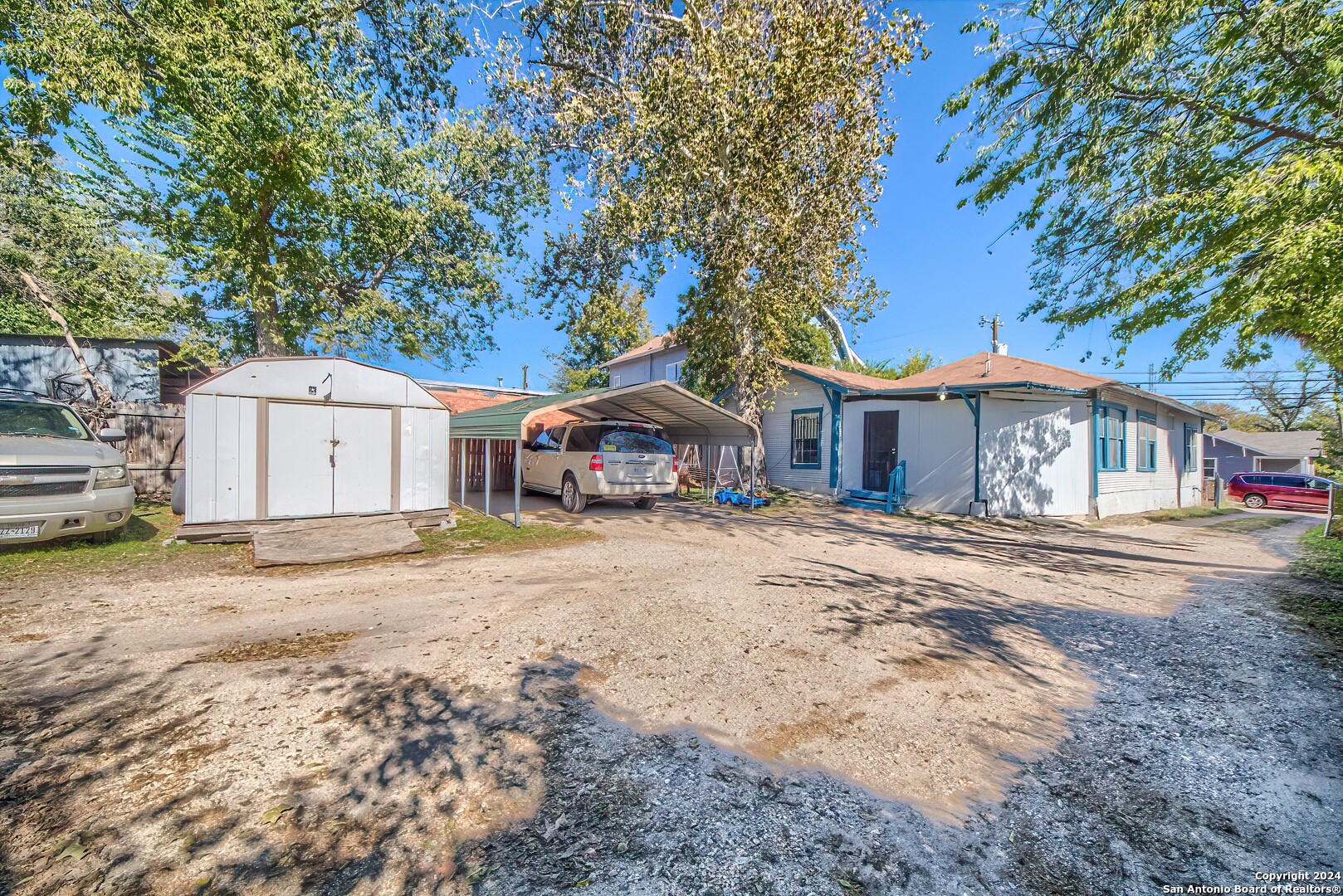 211 Blanco Road San Antonio, TX 78212 - Photo 33 of 34 a front view of a house with a yard and garage