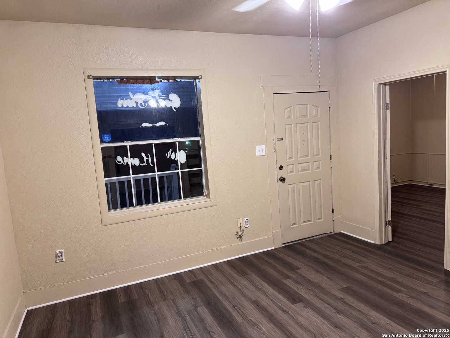 211 Blanco Road San Antonio, TX 78212 - Photo 4 of 34 a view of an empty room with wooden floor and a window
