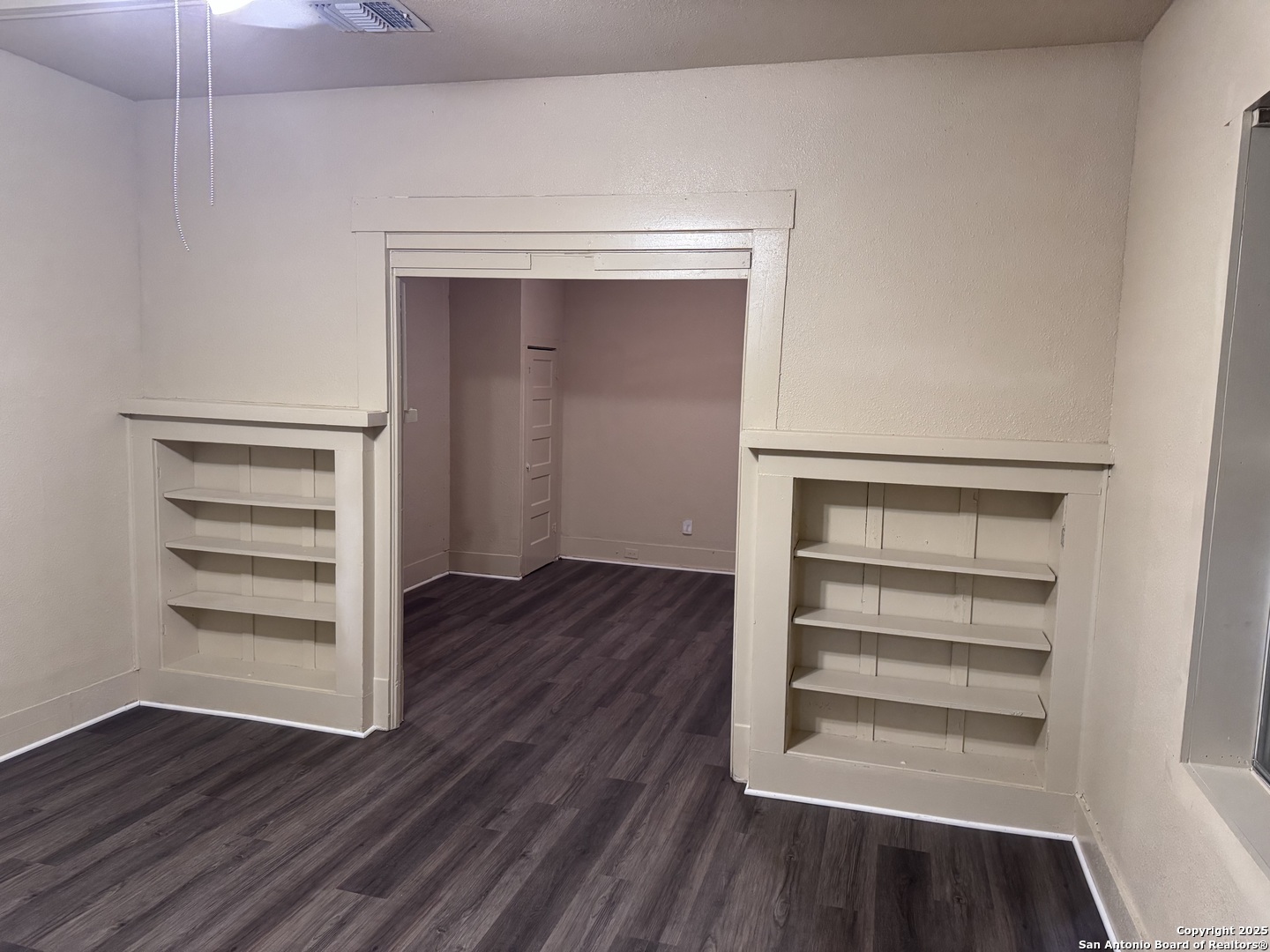 211 Blanco Road San Antonio, TX 78212 - Photo 5 of 34 a view of walk in closet with wooden floor