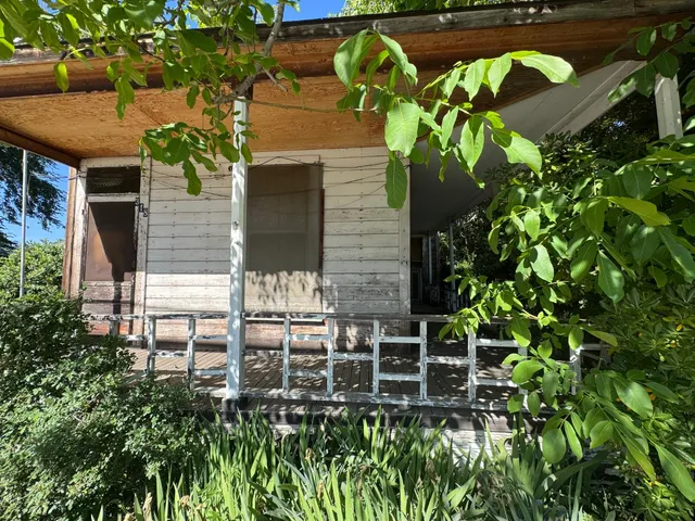a backyard of a house with lots of green space