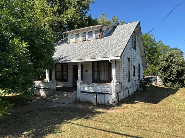 a front view of house with yard outdoor seating and yard
