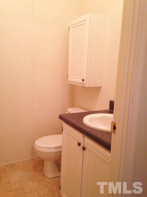 1696 Jack Clement Road Stem, NC 27581 - Photo 18 of 18 Half Bath off the Utility Room