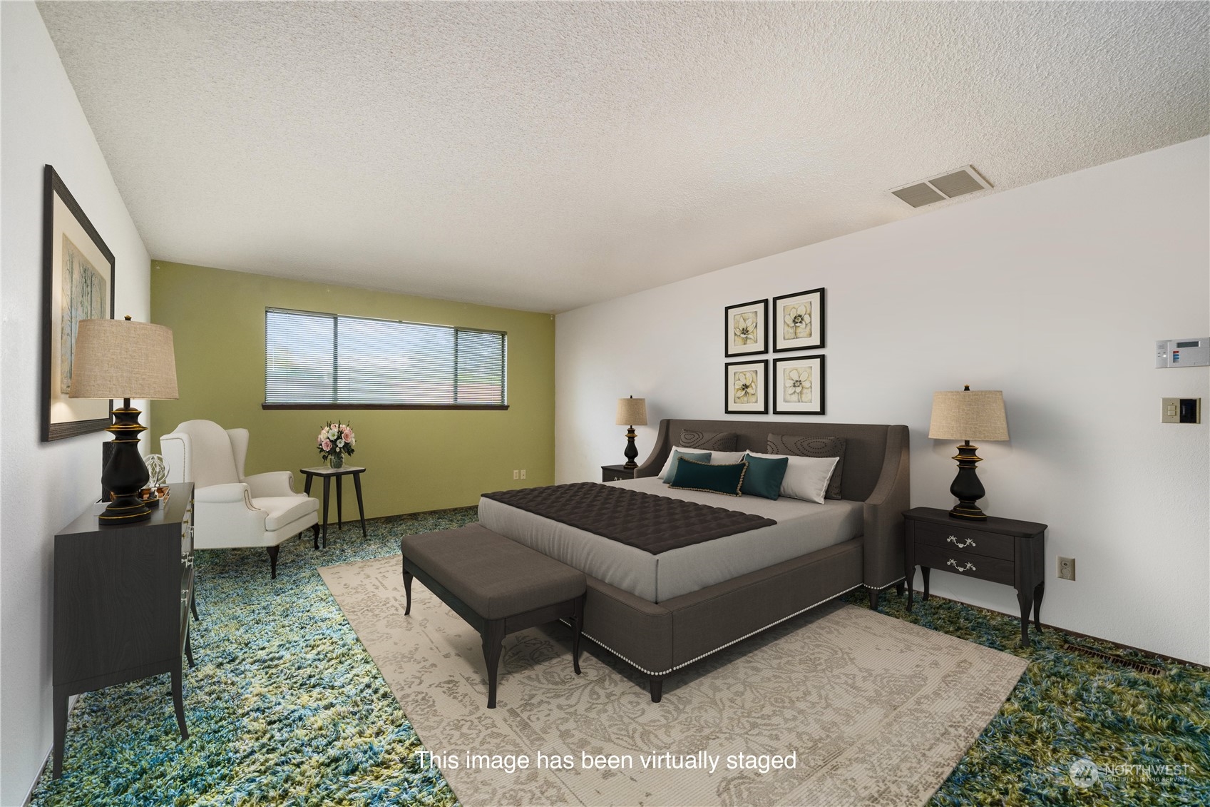 2435 McHugh Avenue Enumclaw, WA 98022 - Photo 19 of 35 a spacious bedroom with a bed and a couch