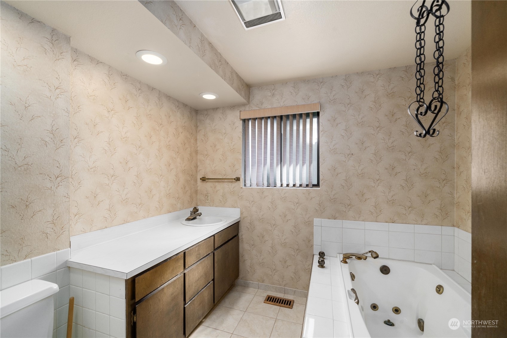 2435 McHugh Avenue Enumclaw, WA 98022 - Photo 23 of 35 a bathroom with a sink a toilet and a mirror