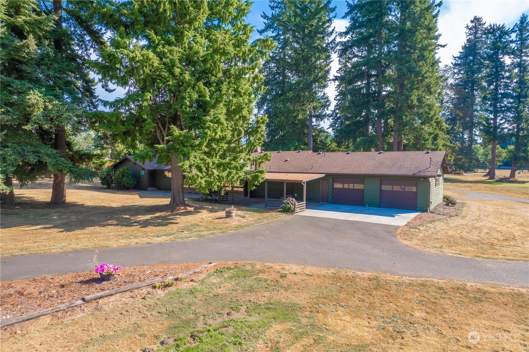 2435 McHugh Avenue Enumclaw, WA 98022 - Photo 3 of 35 a view of a house with snow on the road