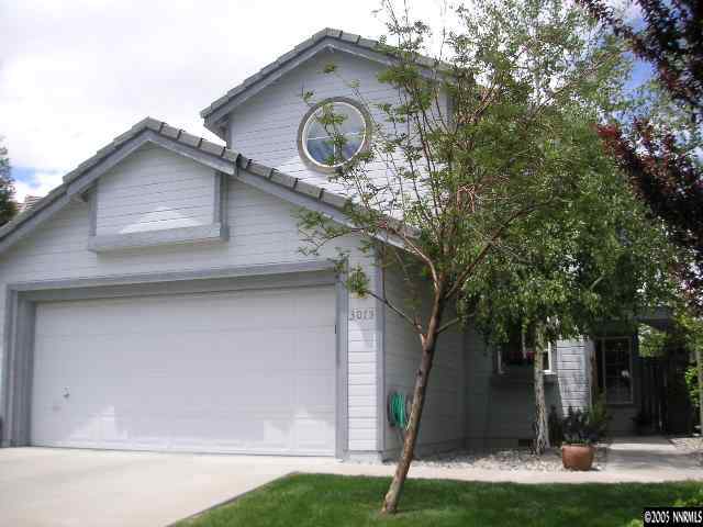 3075 Alpine Creek Road Reno, NV 89519 - Photo 1 of 9 a view of a house with a small yard and large tree