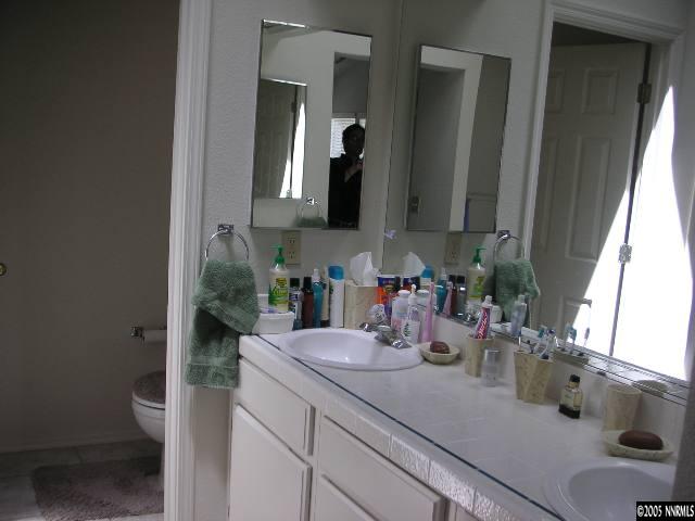 3075 Alpine Creek Road Reno, NV 89519 - Photo 5 of 9 a bathroom with sink and mirror