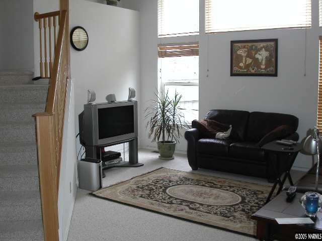 3075 Alpine Creek Road Reno, NV 89519 - Photo 6 of 9 a living room with furniture a rug and a window