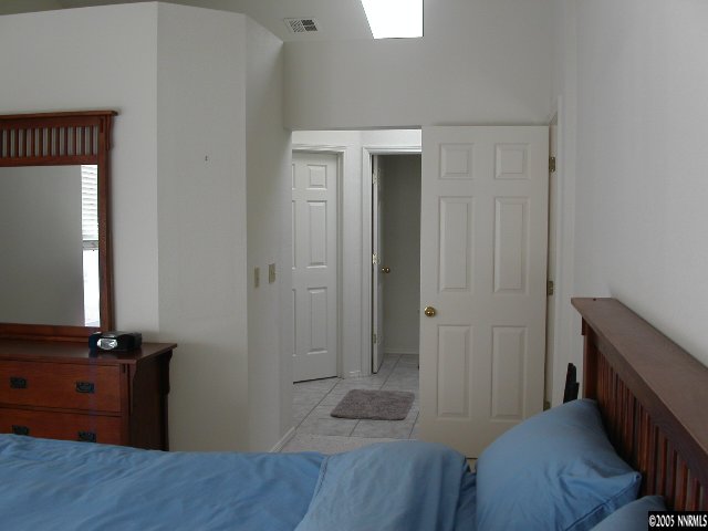 3075 Alpine Creek Road Reno, NV 89519 - Photo 7 of 9 a room with a bed and wooden floor