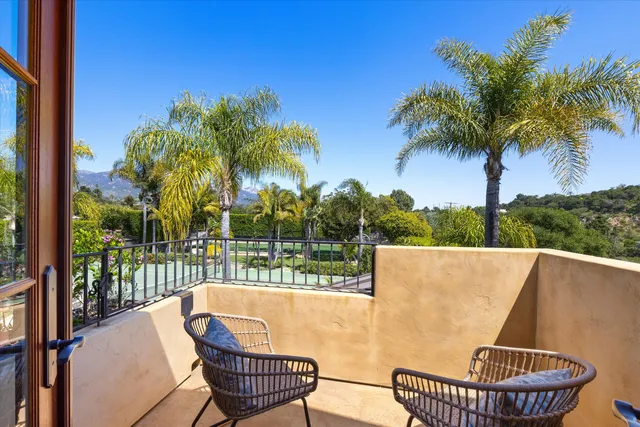 a view of a chairs and table in patio