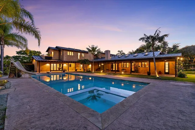 a view of a swimming pool with a lounge chairs