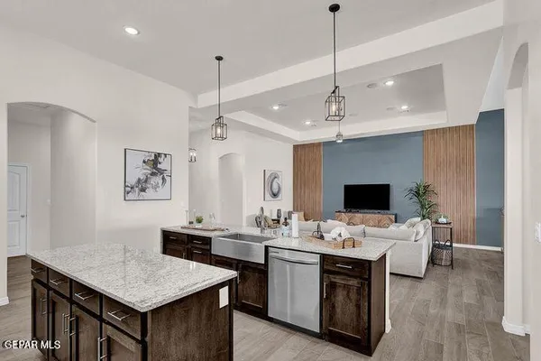 a work room with furniture and large window