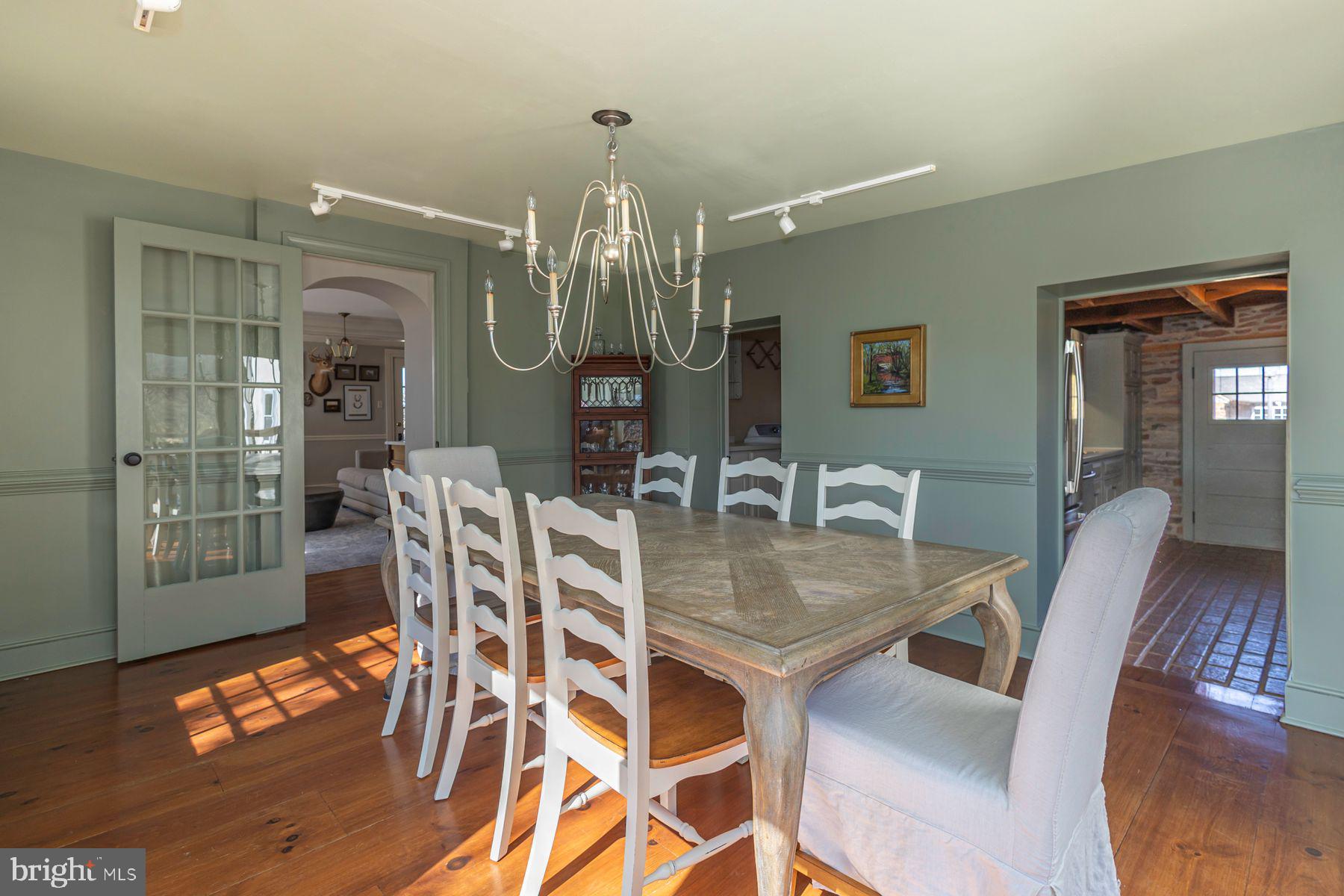 718 Telegraph Road Perkasie, PA 18944 - Photo 11 of 47 a view of a dining room with furniture and wooden floor