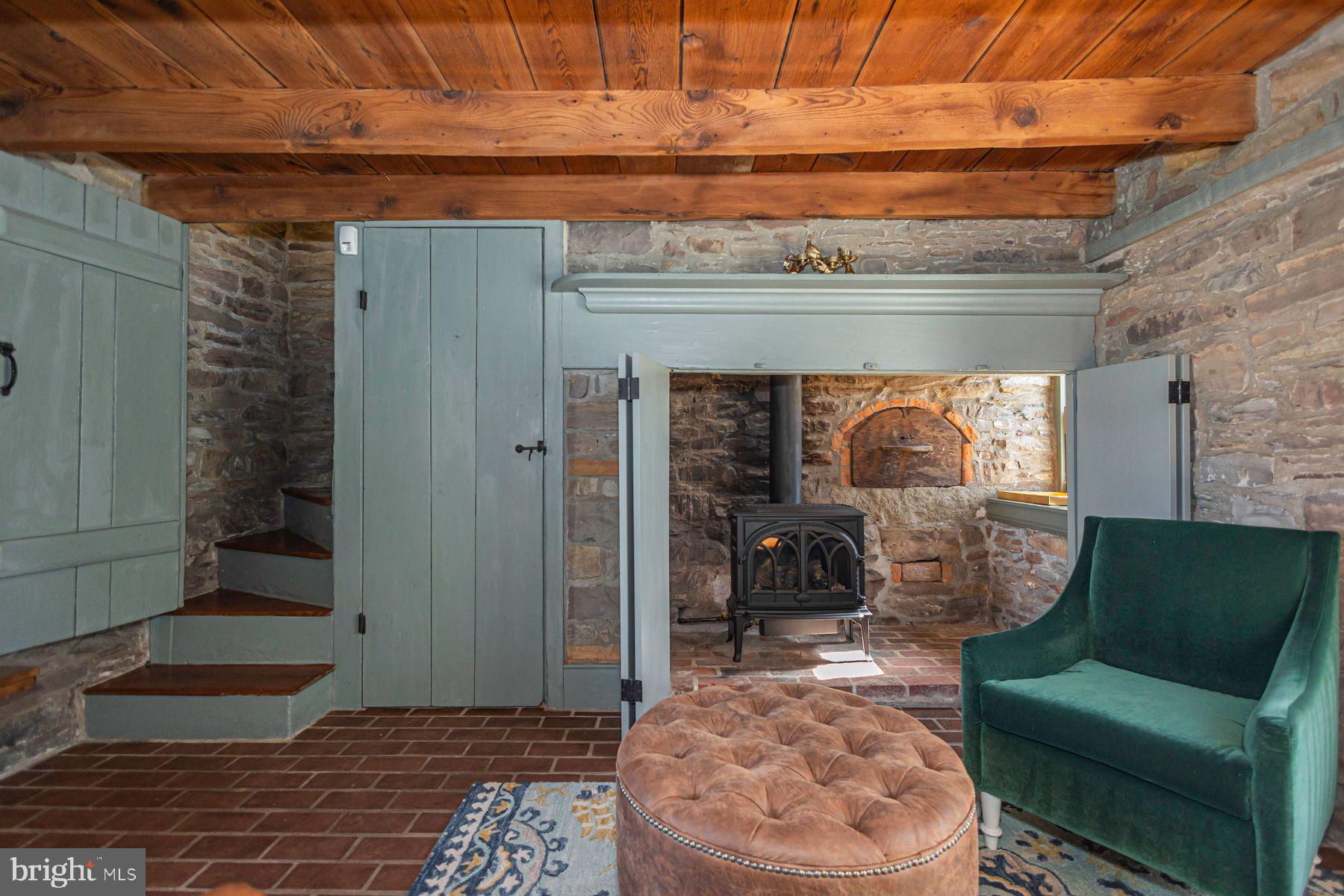 718 Telegraph Road Perkasie, PA 18944 - Photo 18 of 47 a living room with furniture and a fireplace
