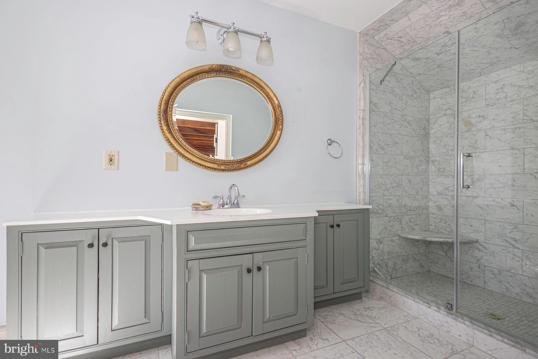 718 Telegraph Road Perkasie, PA 18944 - Photo 23 of 47 a bathroom with a granite countertop toilet a sink and a mirror