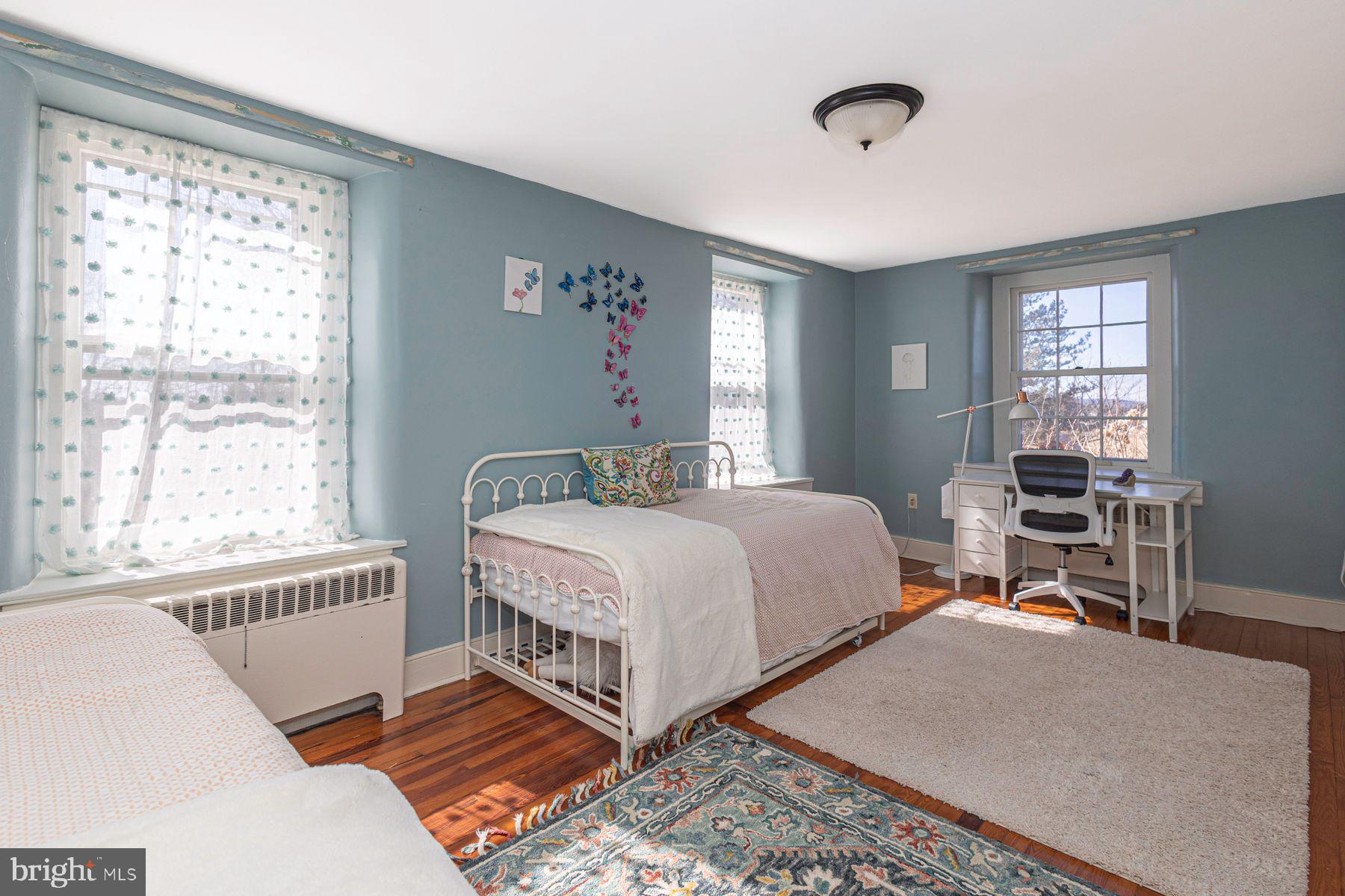 718 Telegraph Road Perkasie, PA 18944 - Photo 24 of 47 a bedroom with a bed and windows