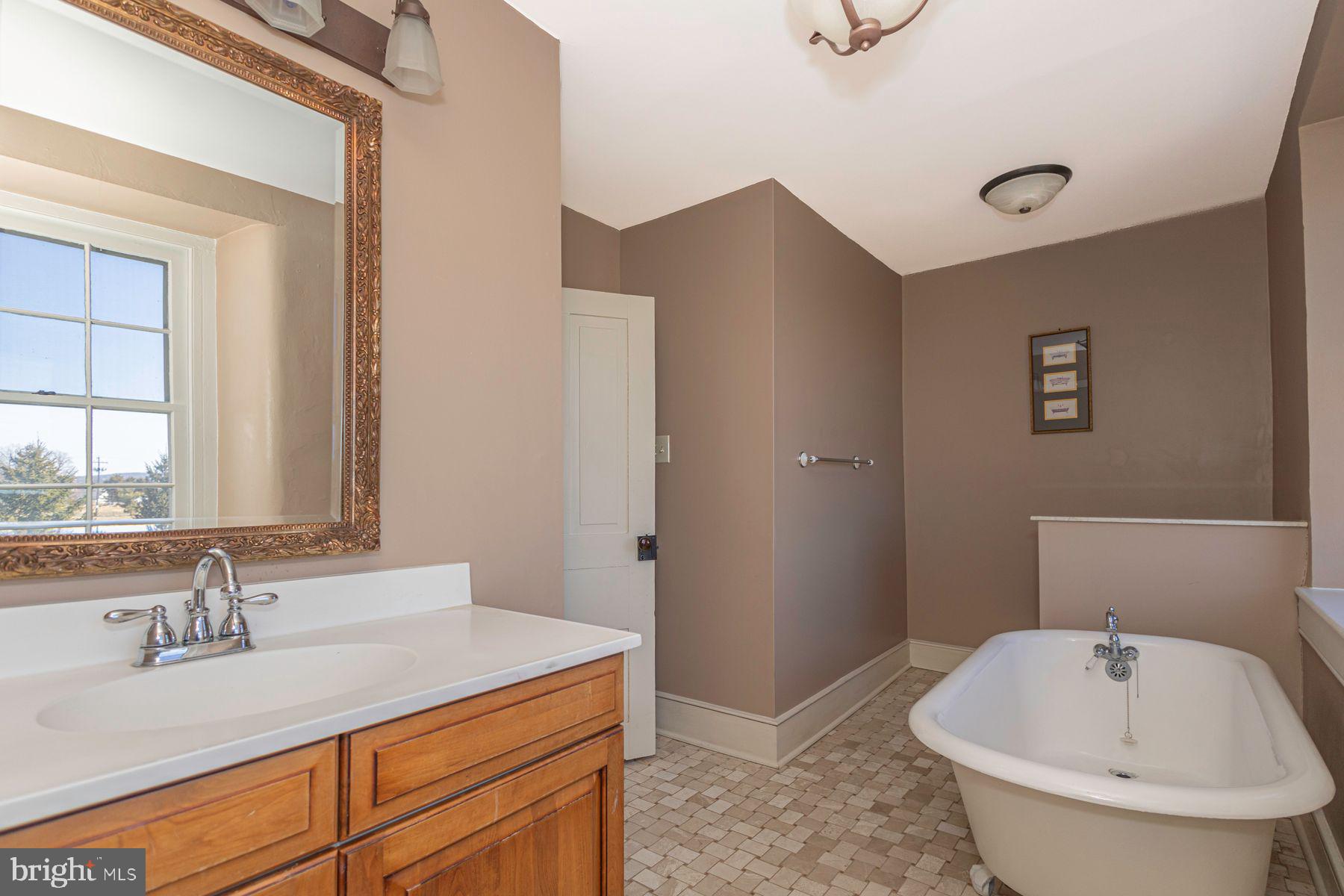 718 Telegraph Road Perkasie, PA 18944 - Photo 26 of 47 a bathroom with a sink and a bathtub