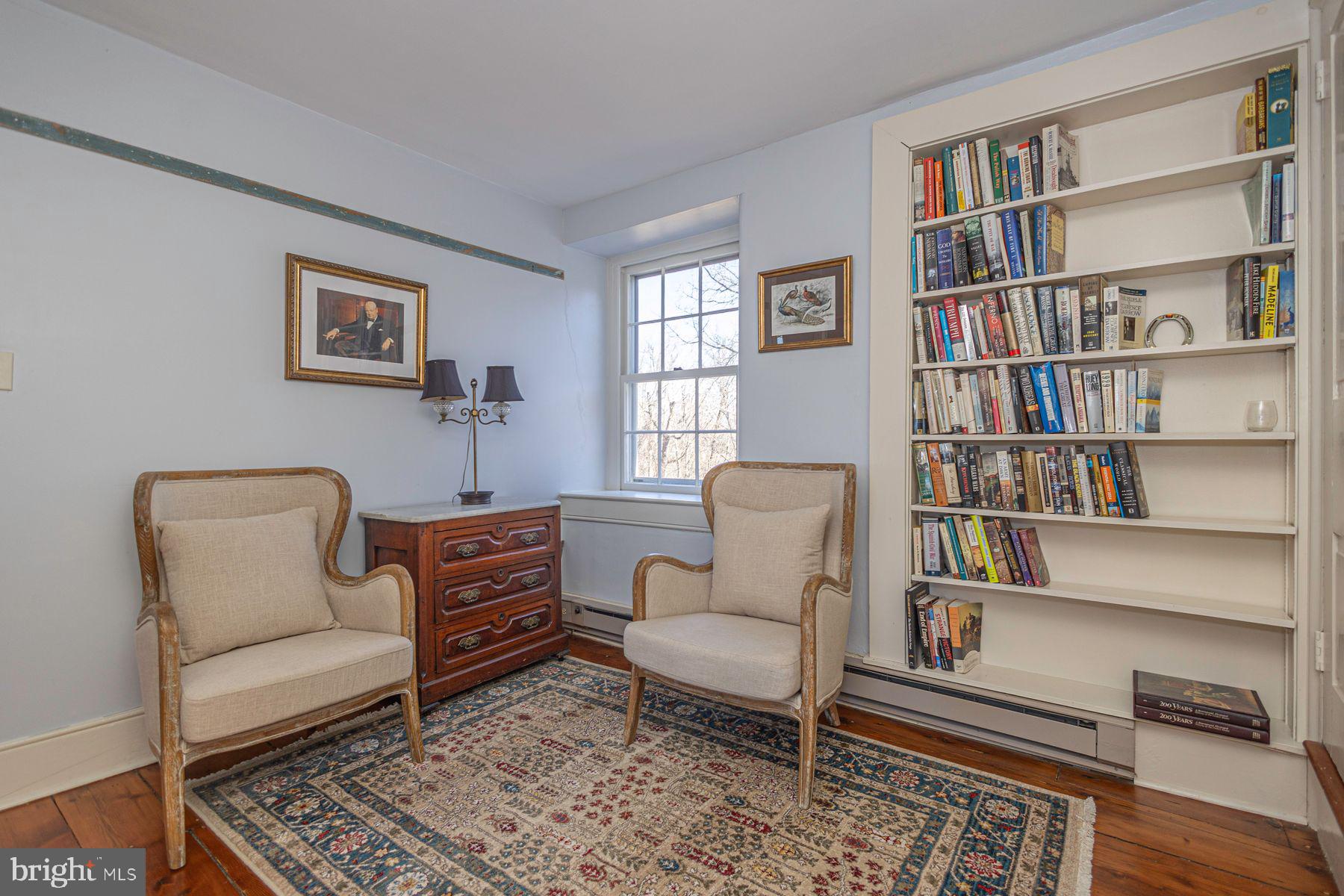 718 Telegraph Road Perkasie, PA 18944 - Photo 27 of 47 a living room with furniture and a book shelf
