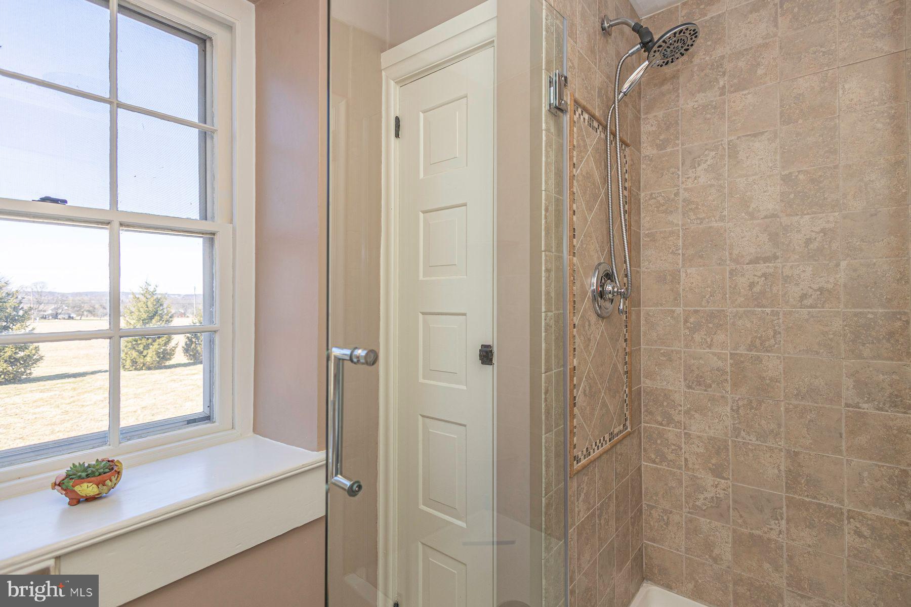 718 Telegraph Road Perkasie, PA 18944 - Photo 31 of 47 a bathroom with a sink and a window