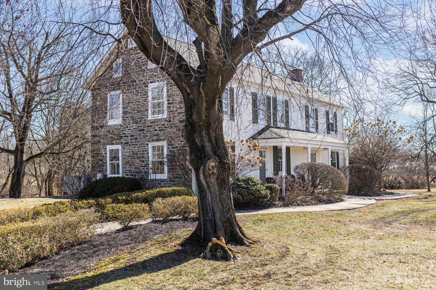 718 Telegraph Road Perkasie, PA 18944 - Photo 40 of 47 a front view of a house with a yard covered with snow