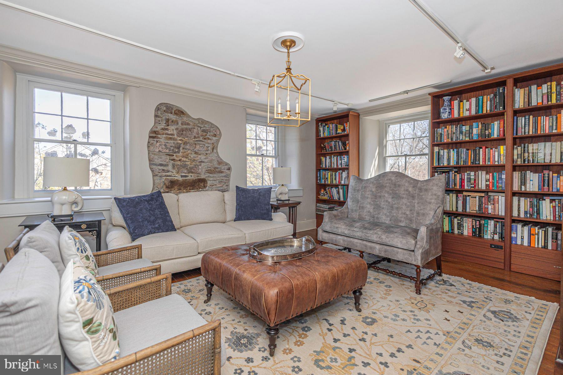 718 Telegraph Road Perkasie, PA 18944 - Photo 5 of 47 a living room with furniture a window and a chandelier