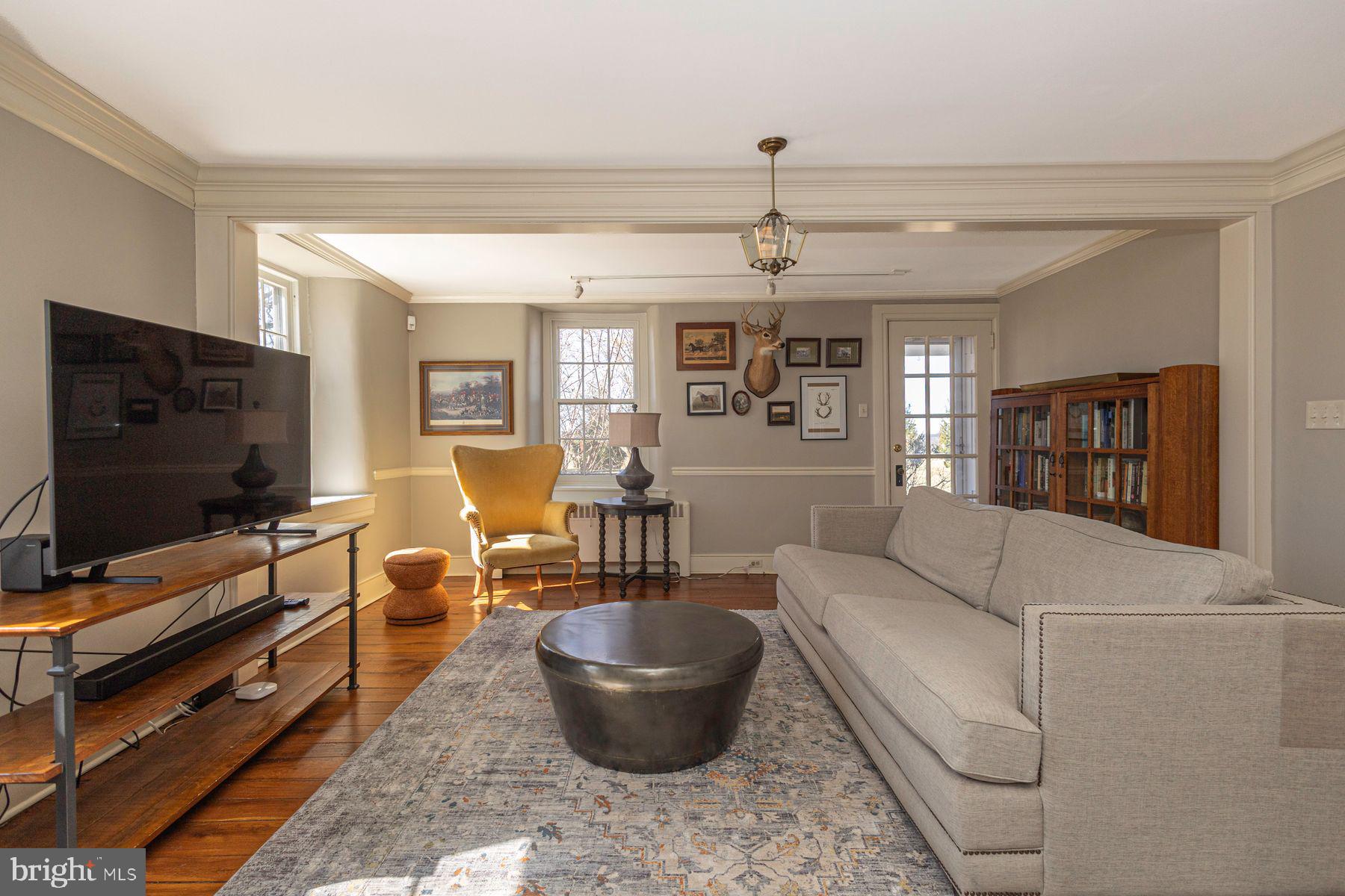 718 Telegraph Road Perkasie, PA 18944 - Photo 8 of 47 a living room with furniture and a flat screen tv