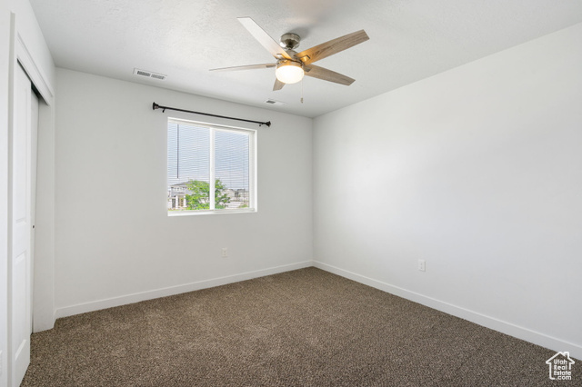 3456 South Linden Way Syracuse, UT 84075 - Photo 27 of 50 Bedroom featuring carpet floors, a closet, baseboards, and ceiling fan