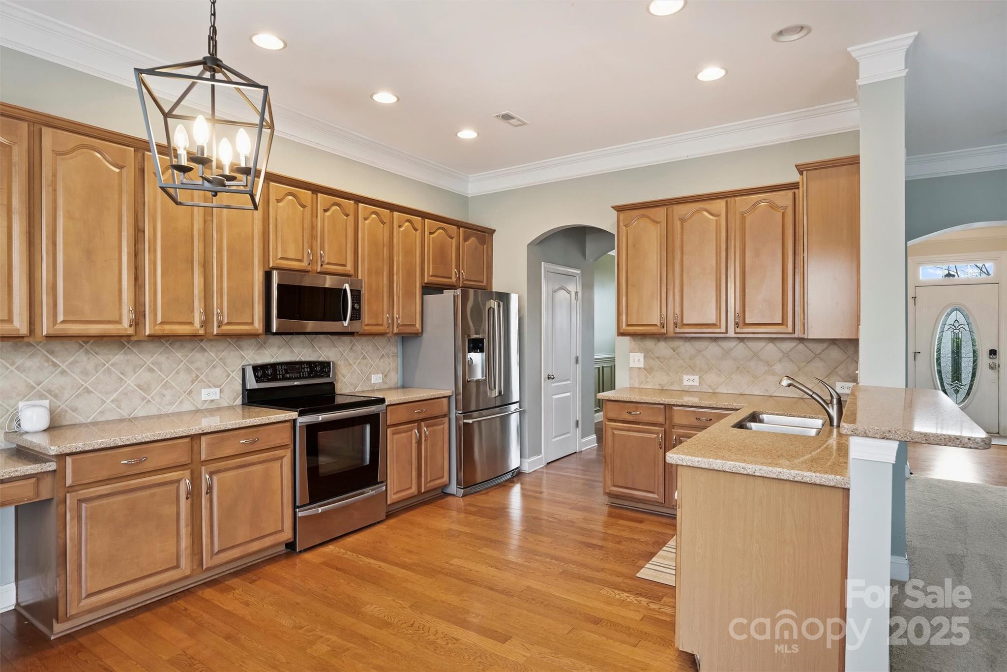 10513 Serape Road Charlotte, NC 28277 - Photo 19 of 45 a kitchen with stainless steel appliances granite countertop a sink stove and refrigerator
