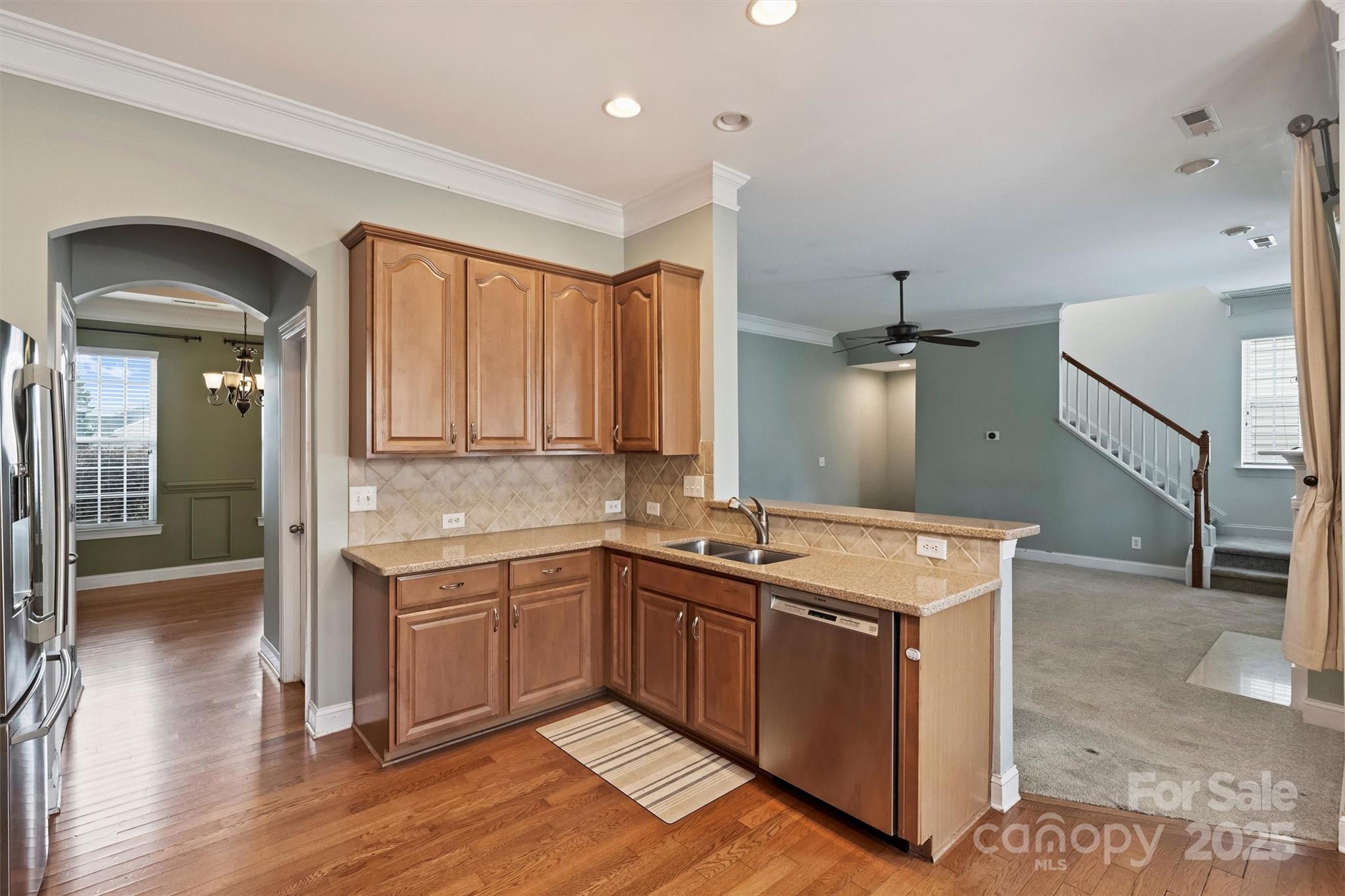 10513 Serape Road Charlotte, NC 28277 - Photo 22 of 45 a kitchen with a sink and cabinets