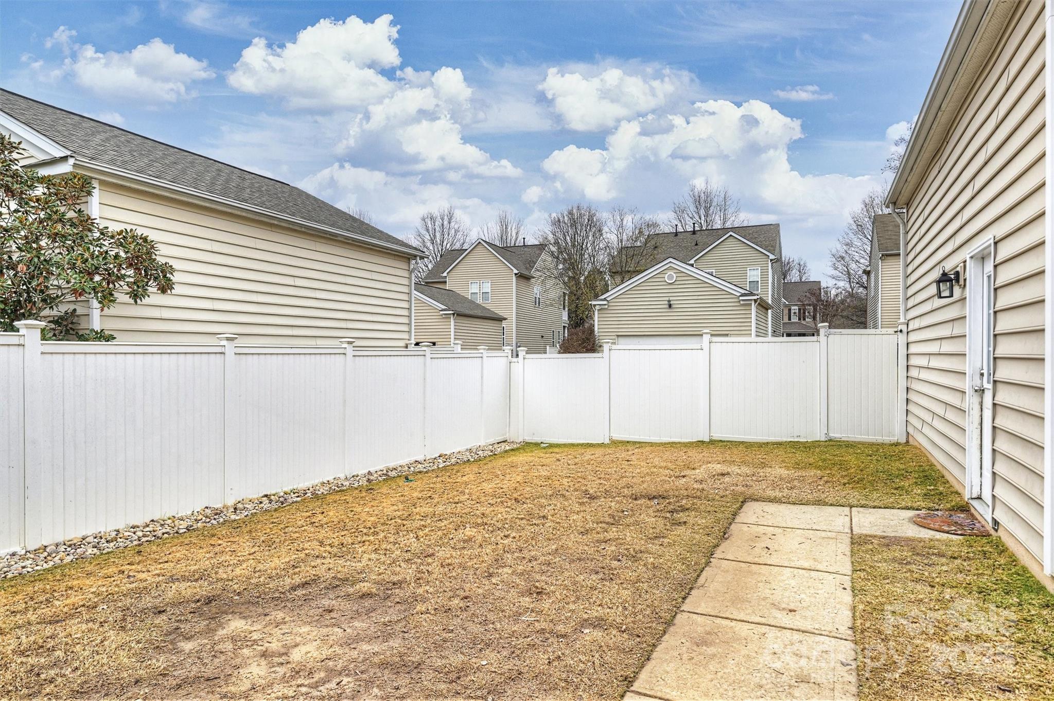 10513 Serape Road Charlotte, NC 28277 - Photo 43 of 45 a view of white house with a yard