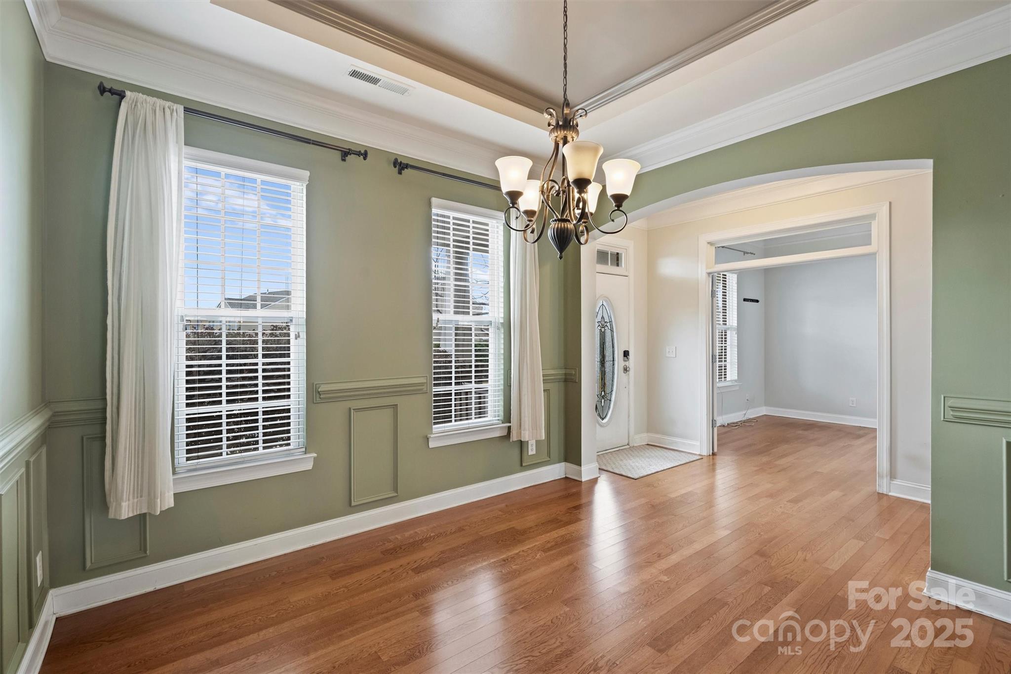 10513 Serape Road Charlotte, NC 28277 - Photo 9 of 45 a view of livingroom with chandelier and wooden floor