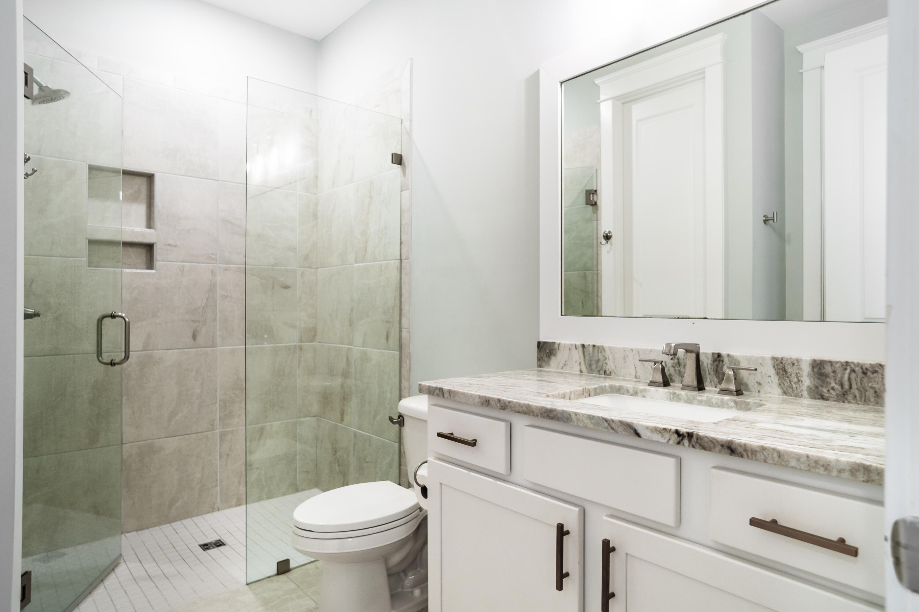 92 Bayou Edge Landing Santa Rosa Beach, FL 32459 - Photo 12 of 43 a bathroom with a granite countertop sink toilet and shower