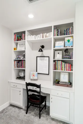 a room with furniture and a book shelf