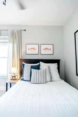 a bedroom with a bed and window