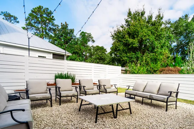 a view of a patio with couple of chairs