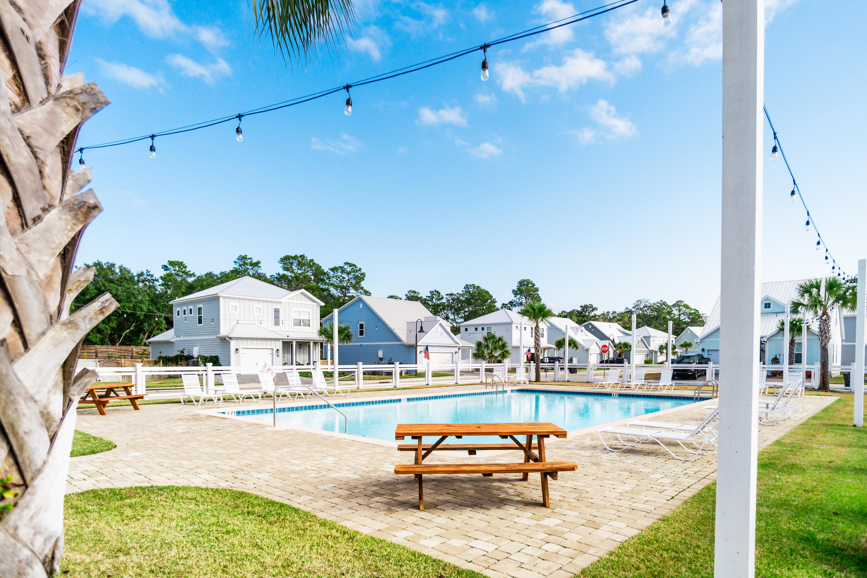 92 Bayou Edge Landing Santa Rosa Beach, FL 32459 - Photo 37 of 43 a swimming pool with outdoor seating and yard