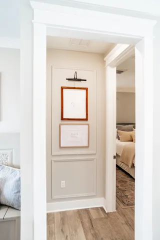 a view of a room that has a bed and a window