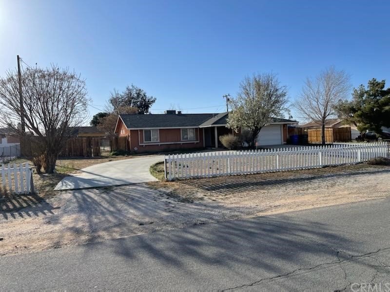 12320 Sholic Road Apple Valley, CA 92308 - Photo 1 of 1 a view of a house with a yard