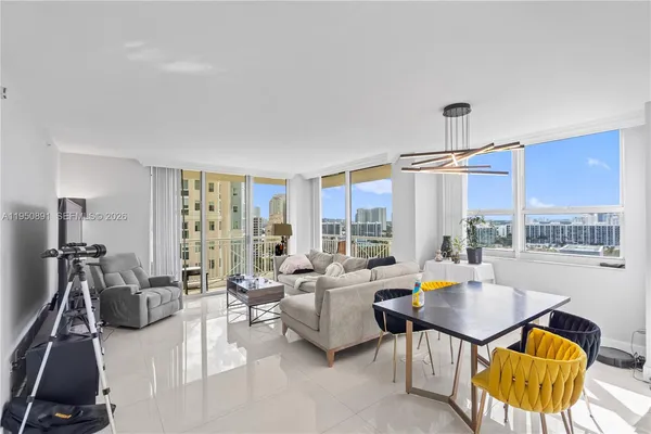 a living room with furniture and a large window