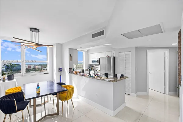 a view of a kitchen and dining room