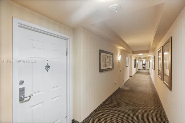 a view of a hallway with front door