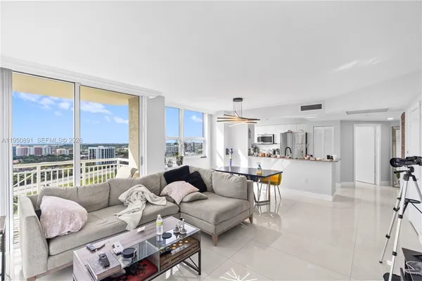 a living room with furniture and a large window