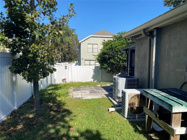 a backyard of a house with lots of green space