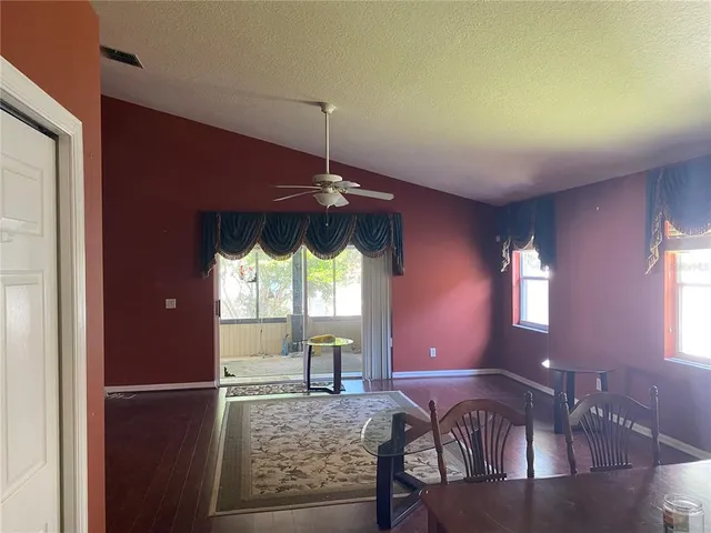 a view of a livingroom with furniture window and wooden floor