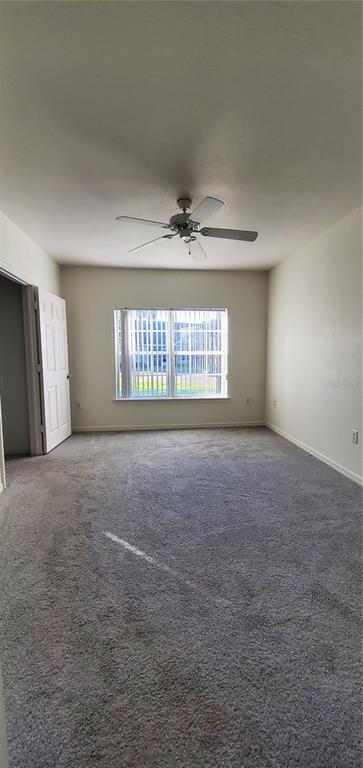 3584 Kings Road, Unit 101 Palm Harbor, FL 34685 - Photo 12 of 17 a view of an empty room with a window