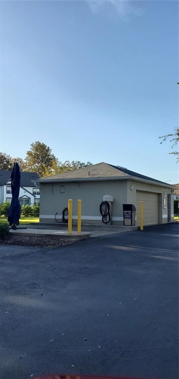 3584 Kings Road, Unit 101 Palm Harbor, FL 34685 - Photo 17 of 17 a house view with a outdoor space