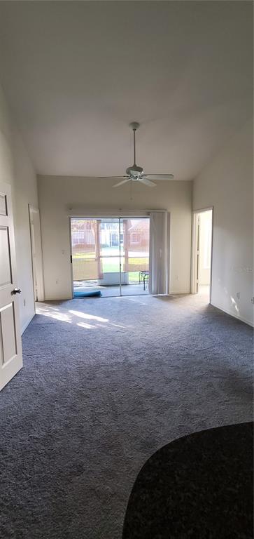 3584 Kings Road, Unit 101 Palm Harbor, FL 34685 - Photo 4 of 17 a view of an empty room with a window