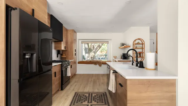 a kitchen with a sink stove and refrigerator