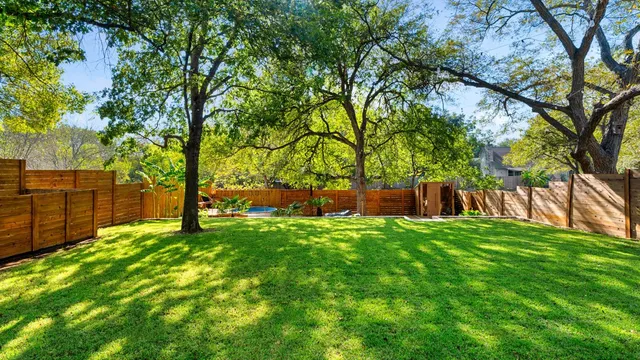 a backyard of a house with lots of green space